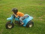 Elijah is hanging out on the 3-wheeler :)