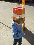 This is another way to keep Elijah out of trouble.... Tie him with 'Caution' tape to an orange barrel :) hehe