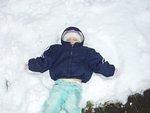 Abigail is attempting to make a snow Angel :) (her 1st one!)