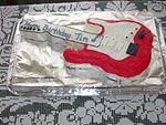 I think the 'Guitar' cake may have given his birthday gift away :P