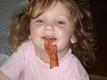 Abby loves her bacon!